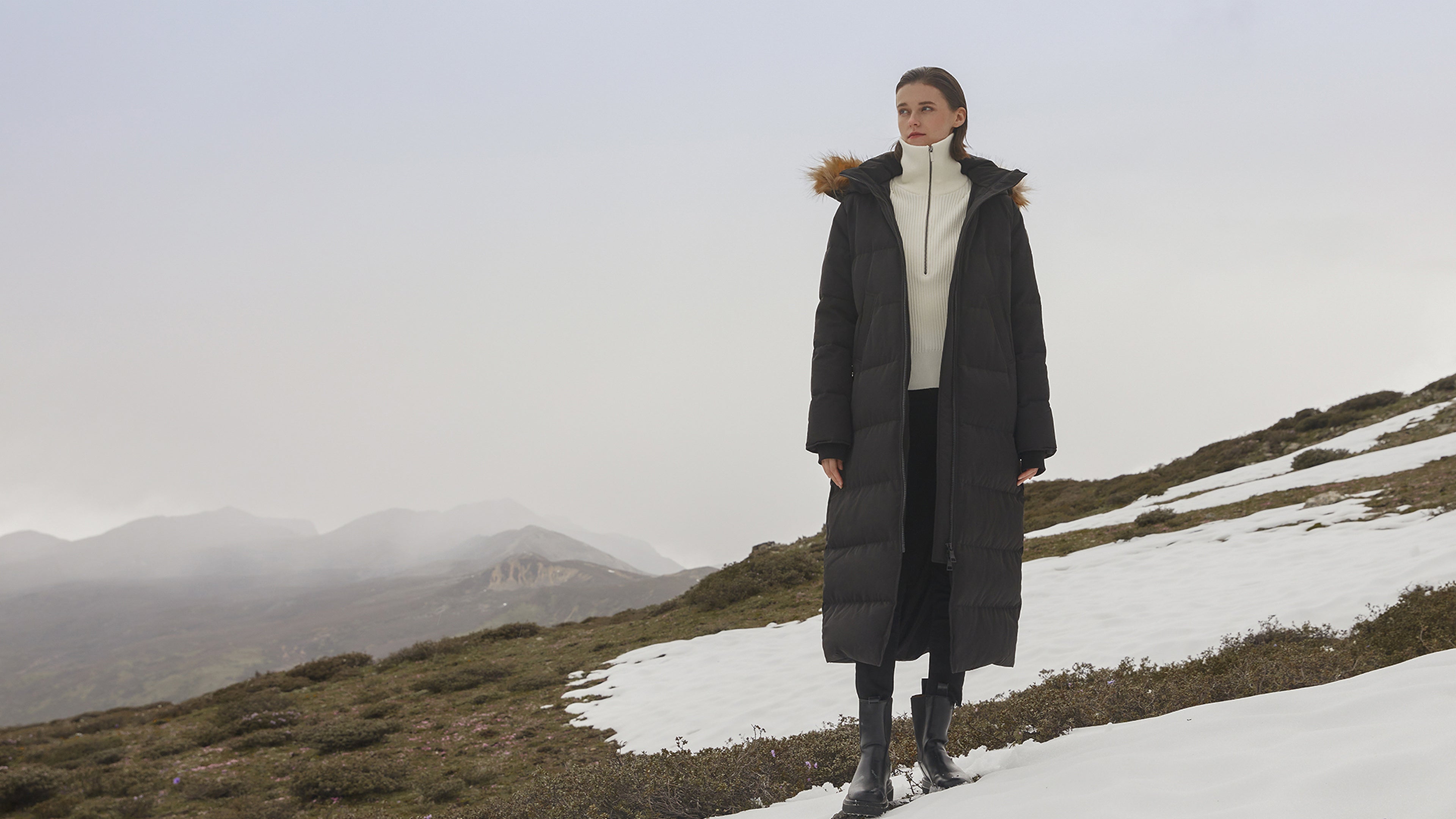 Waukee long down parka in a winter landscape